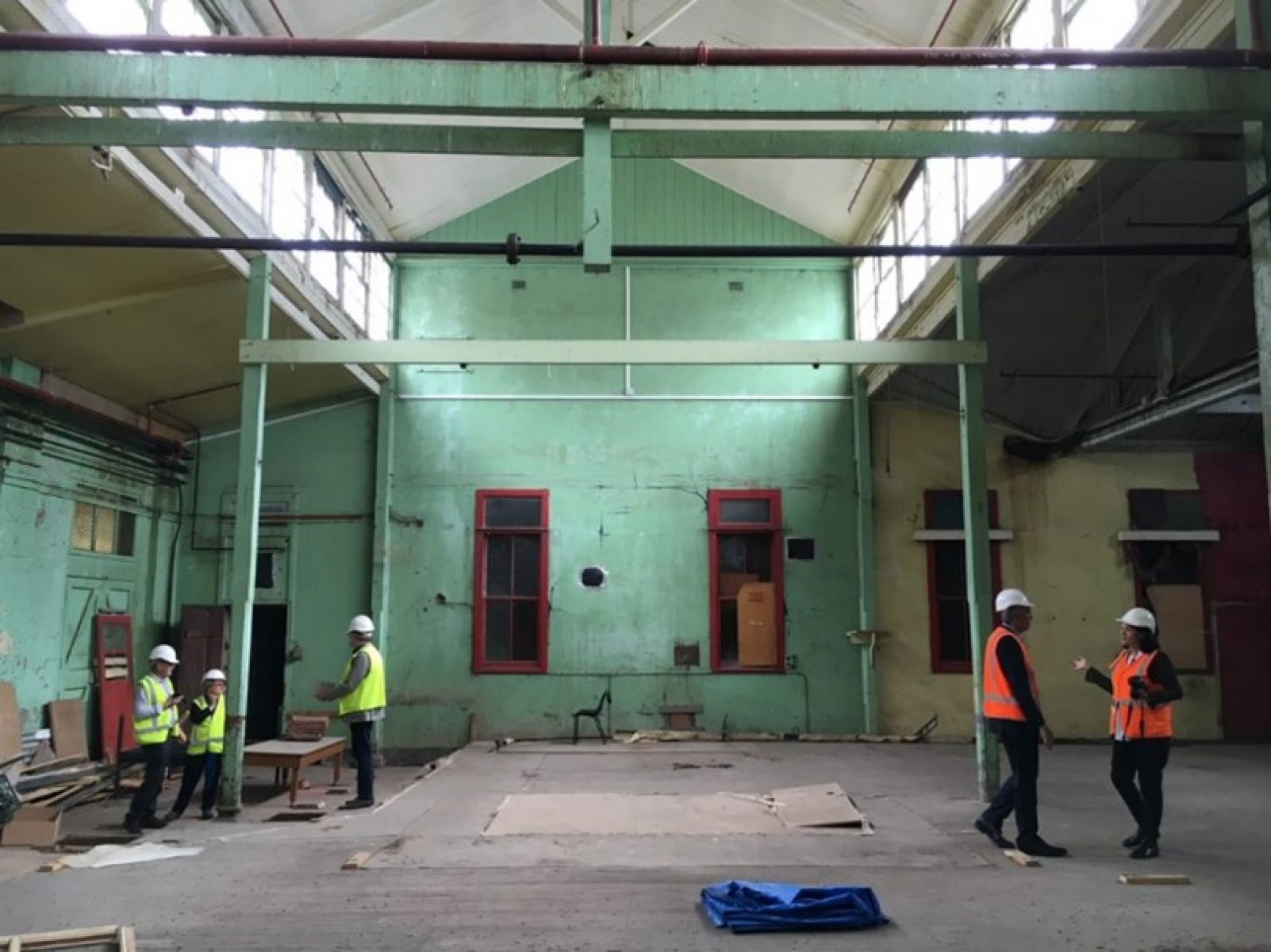 Interior of the Magdalen laundries with workers doing construction of the walls.